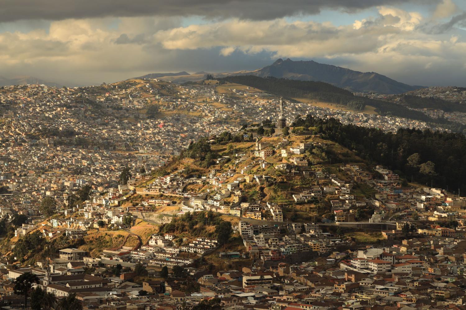 View over city sprawled across hills beneath a cloudy sky, photographed with the Canon RF 70- 200mm f2.8L IS USM lens