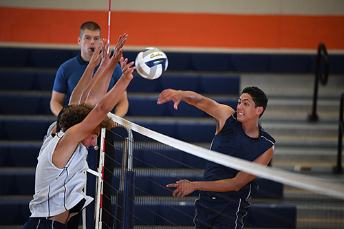 Male volleyball players hitting and defending the ball over the net, shot with the Nikon 120-300mm f2.8 FL ED SR VR lens