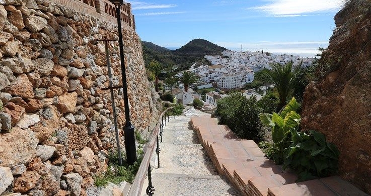 View down steps towards coastal town below, photographed with the Canon 10-18mm wide angle lens