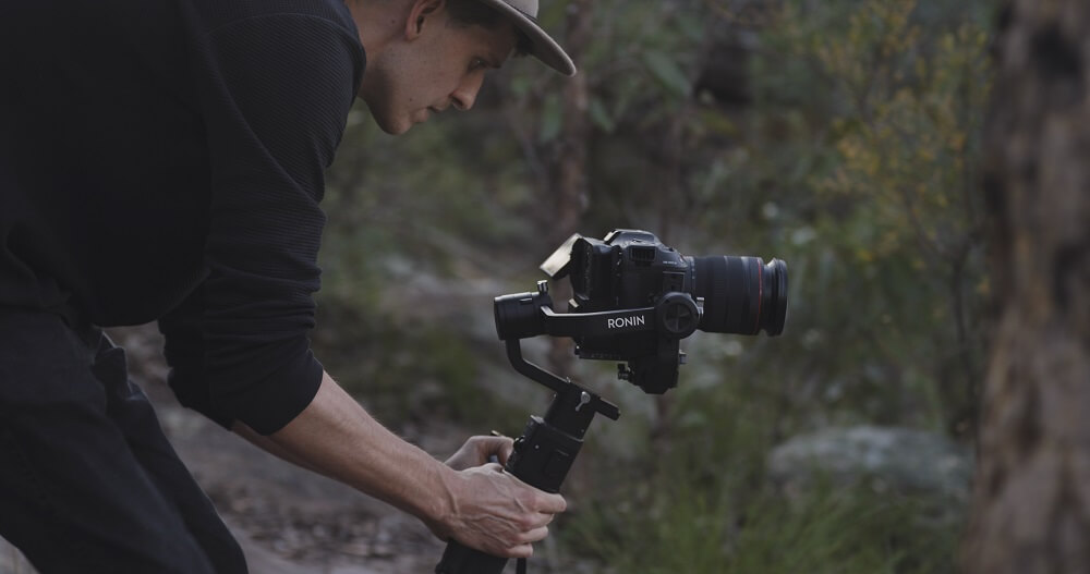 Filmmaker recording with the Canon EOS C70 cinema camera on a Ronin gimbal