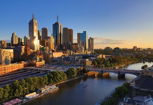 Melbourne city buildings by the Yarra River bathed in golden light, photographed with the Canon EOS RP body