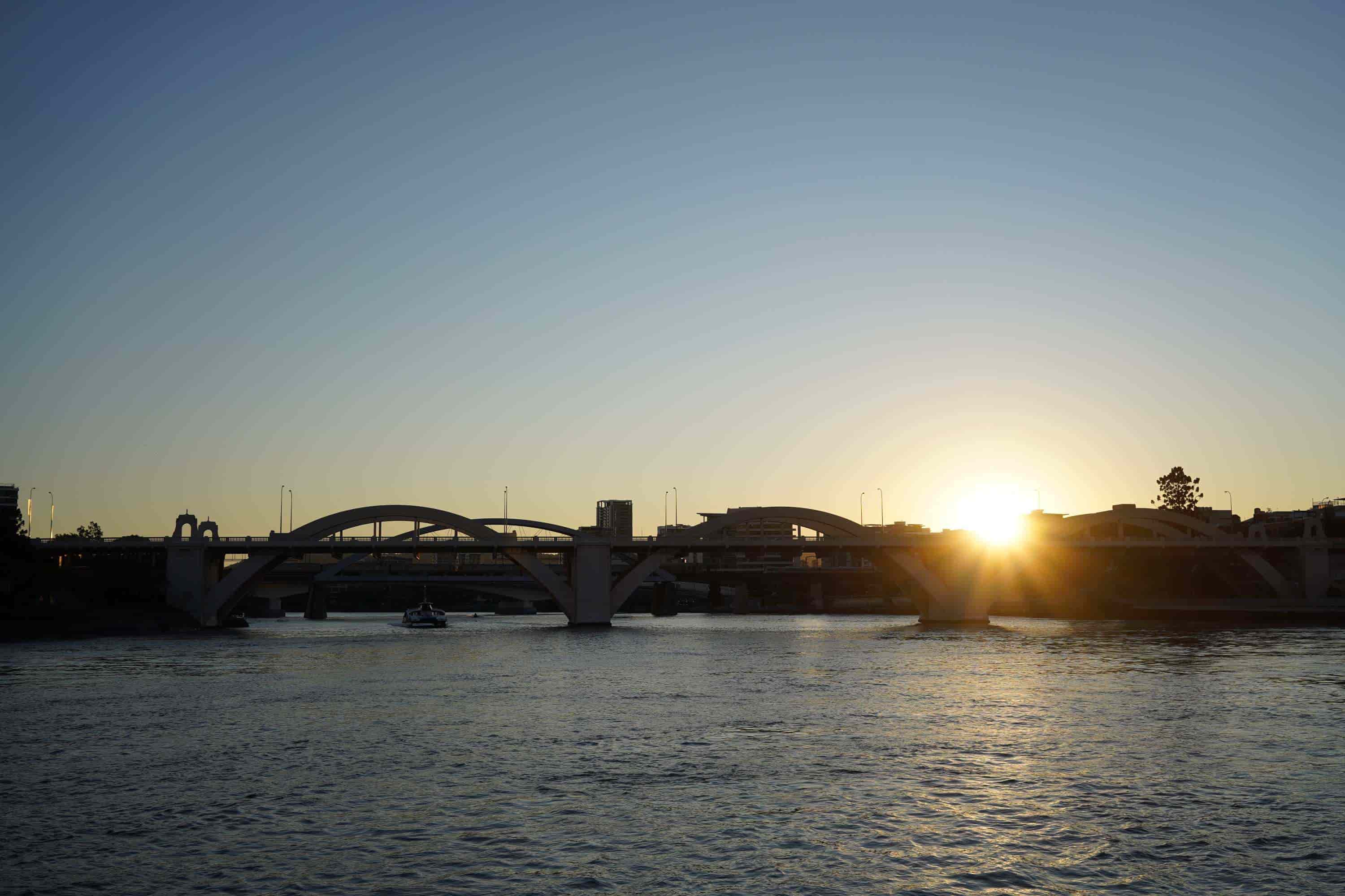 Sun setting over the William Jolly Bridge on the Brisbane River, photographed with the Sony a7C mirrorless camera