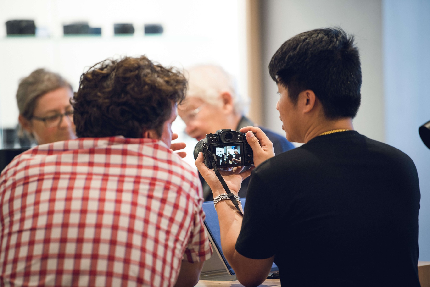 CameraPro employee talking to a customer