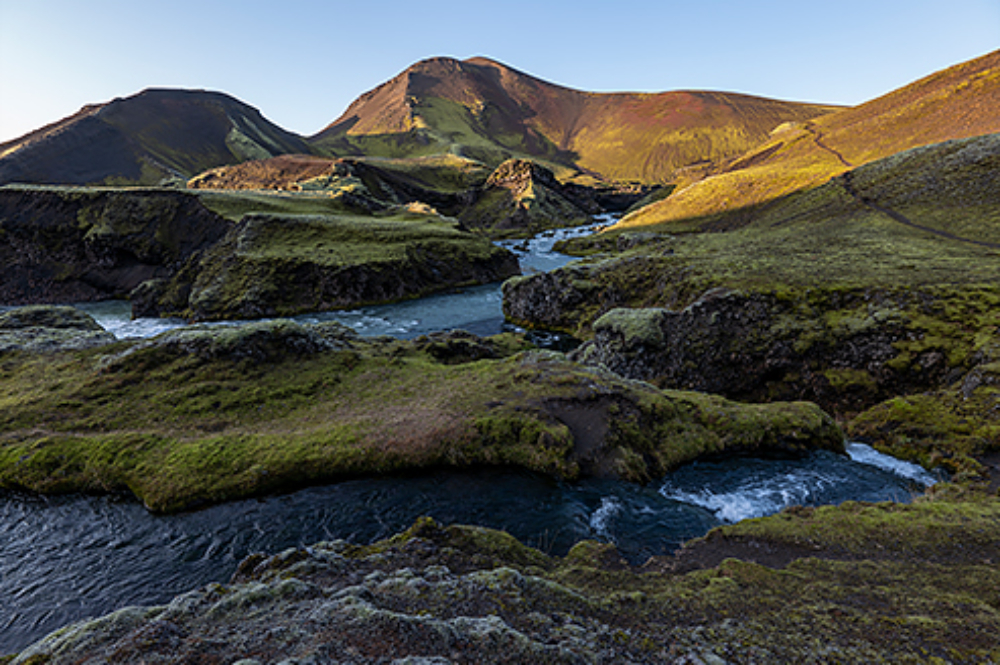 Rolling hills beside water, photographed with the Panasonic Lumix S Pro 16-35mm f4 Lens