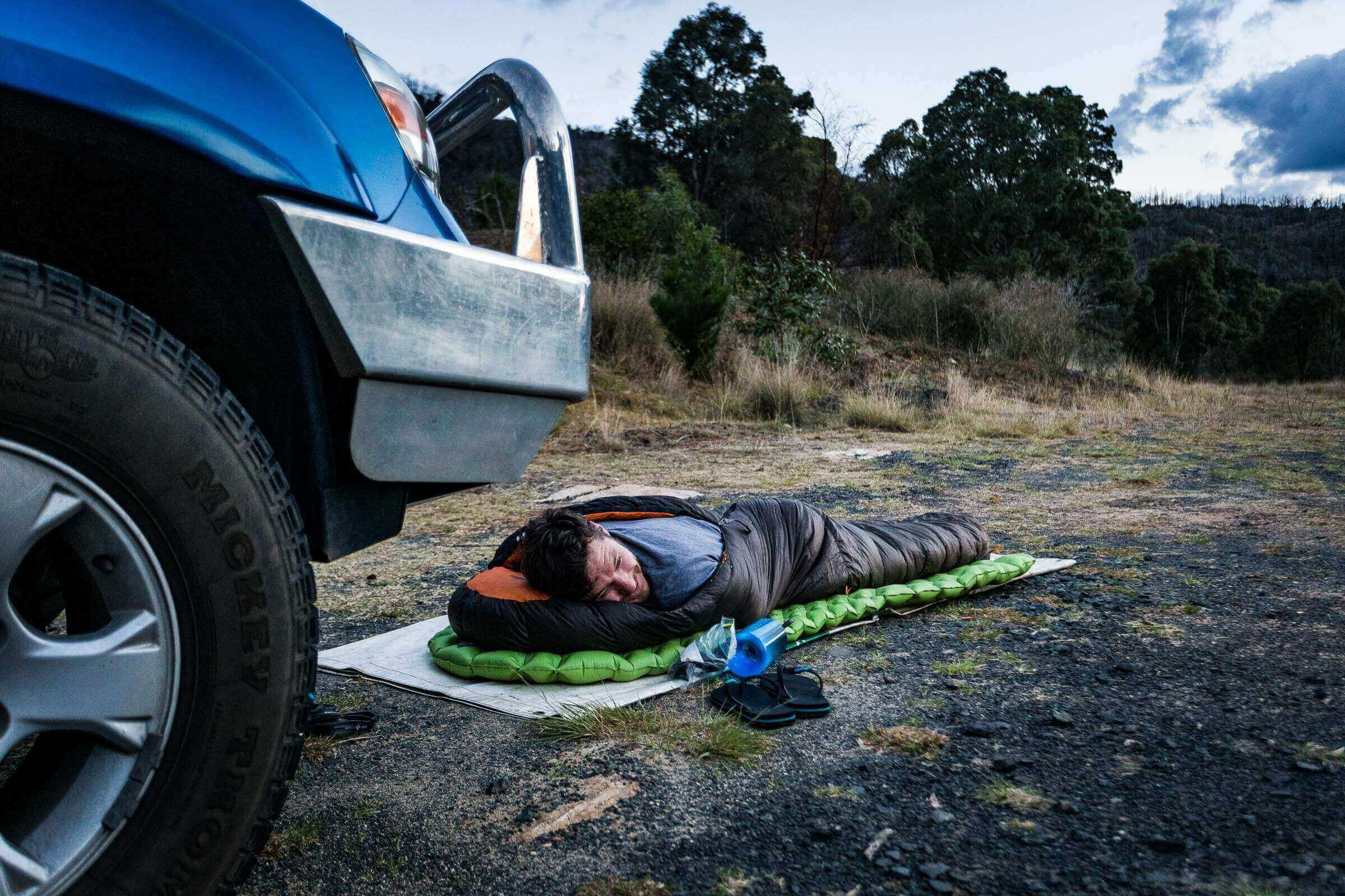 The not-so-glamorous side of adventure: Dave Stone sleeping beside the road on the way to a rock climbing destination