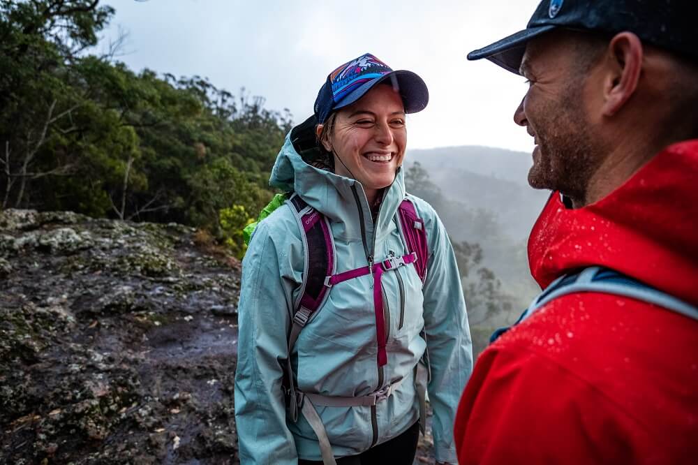 Two mountaineers facing each other while smiling, photographed using the Panasonic Lumix S5