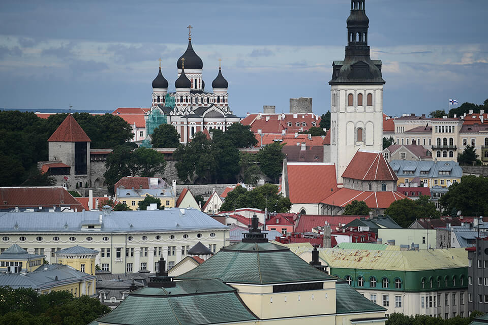 View across city buildings of Tallinn, Estonia to Alexander Nevsky Cathedral, photographed with the