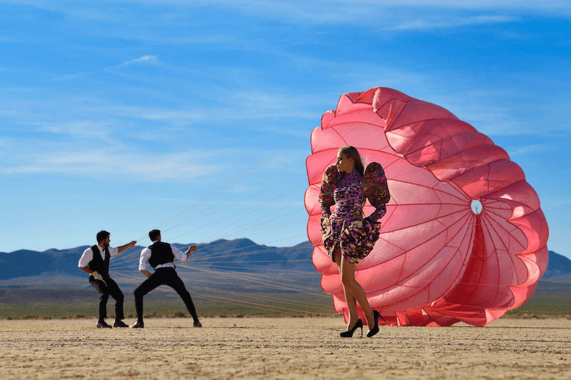 A model posing behind a parachute - taken with Nikon D850