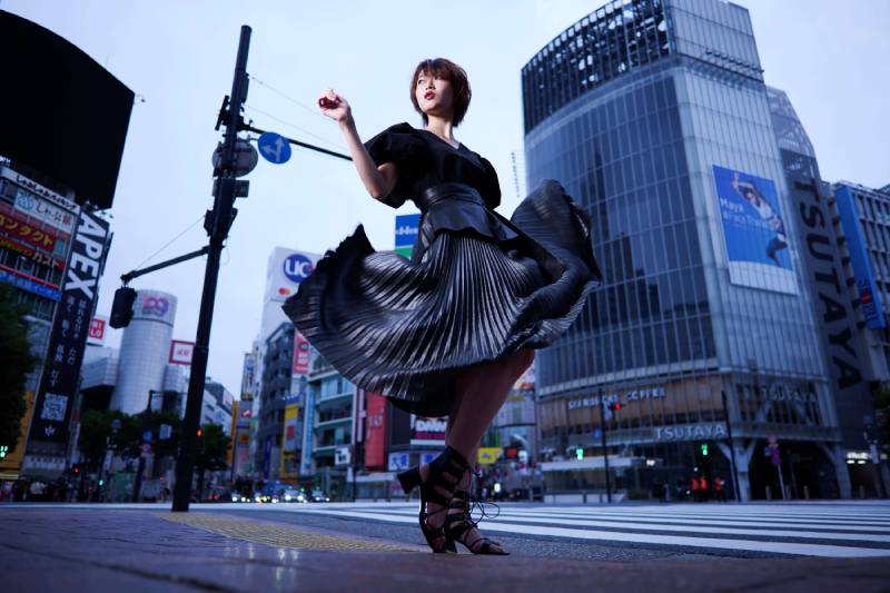 A woman iin black posing in an intersetion in the streets of Japan, taken using a Panasonic Lumix S 24mm f/1.8 Lens