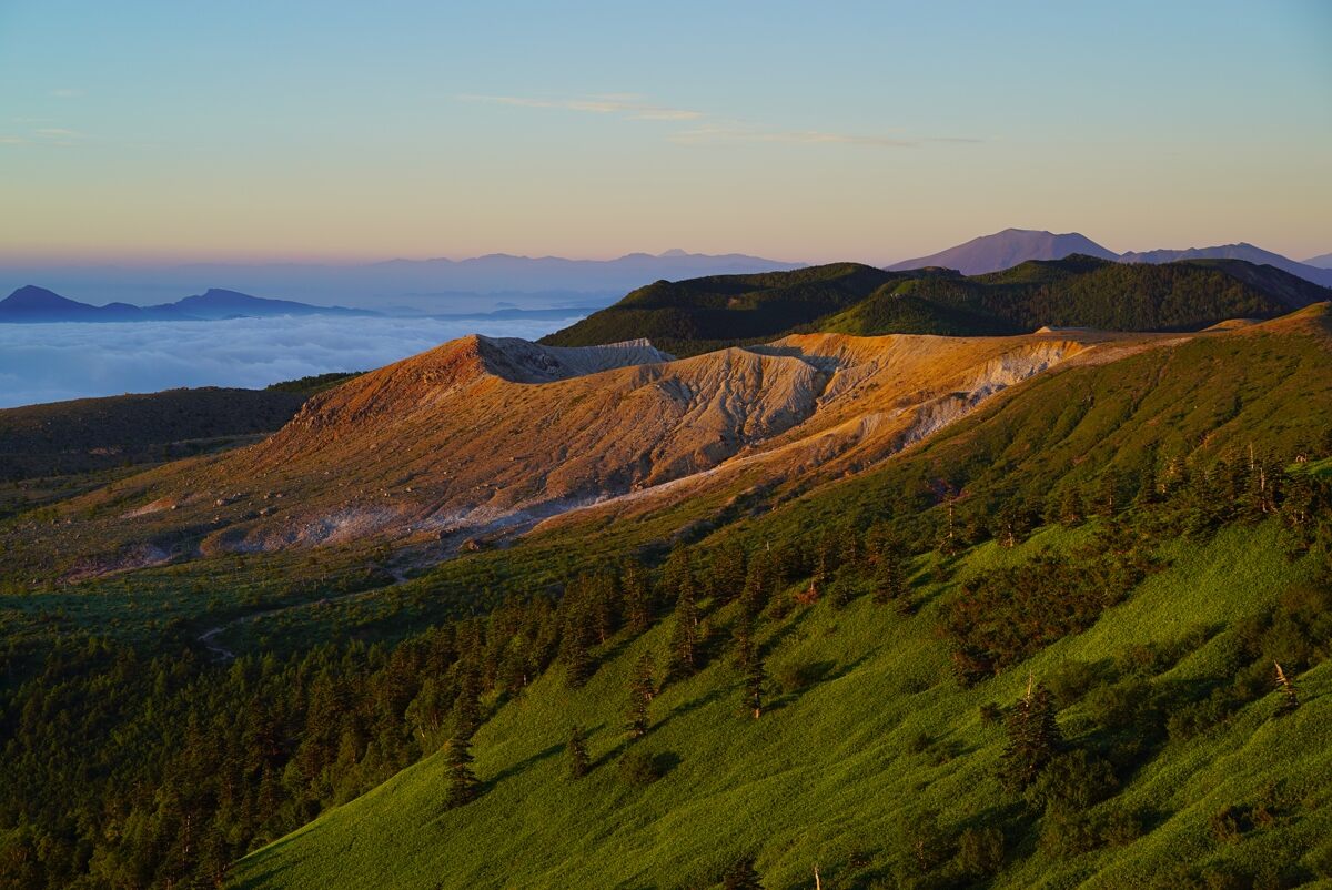 Picturesque scenery over green and brown hills, photographed using the Sony 55mm f1.8 Zeiss lens