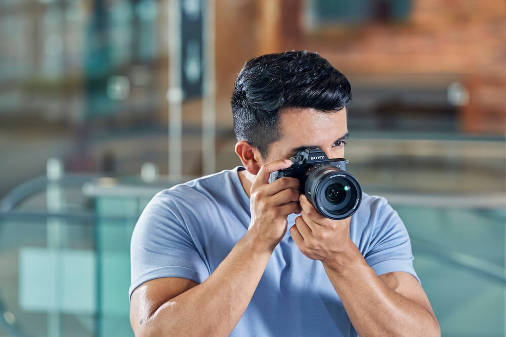 A guy holding the new Sony a7 IV