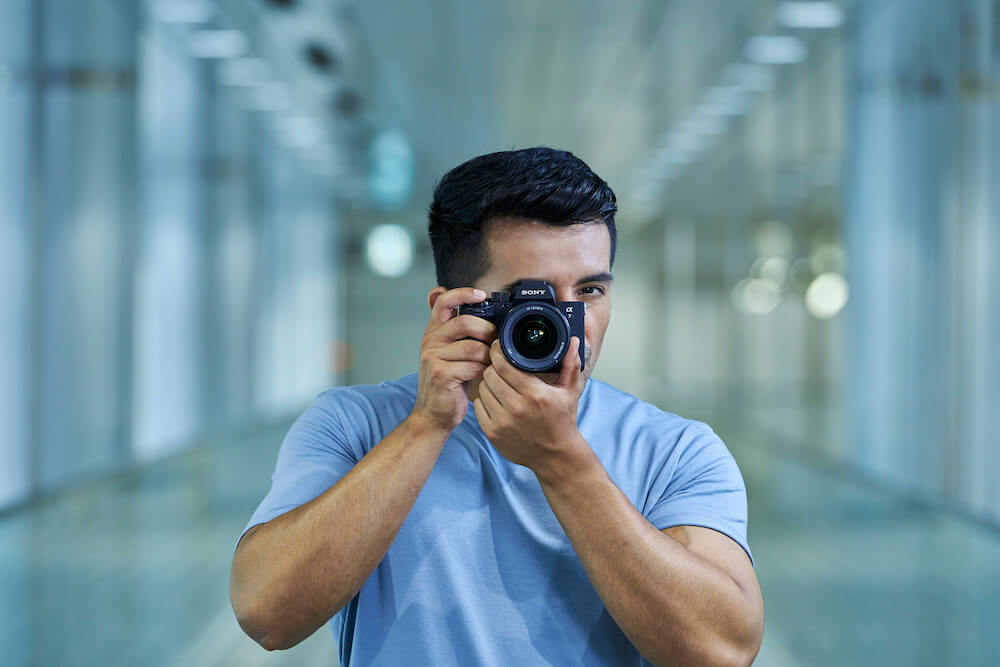 A man holding the new Sony a7 IV