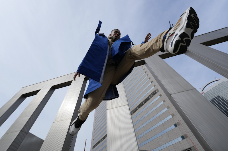 Jumping man in blue, taken with a Sony FE 14mm f/1.8 GM