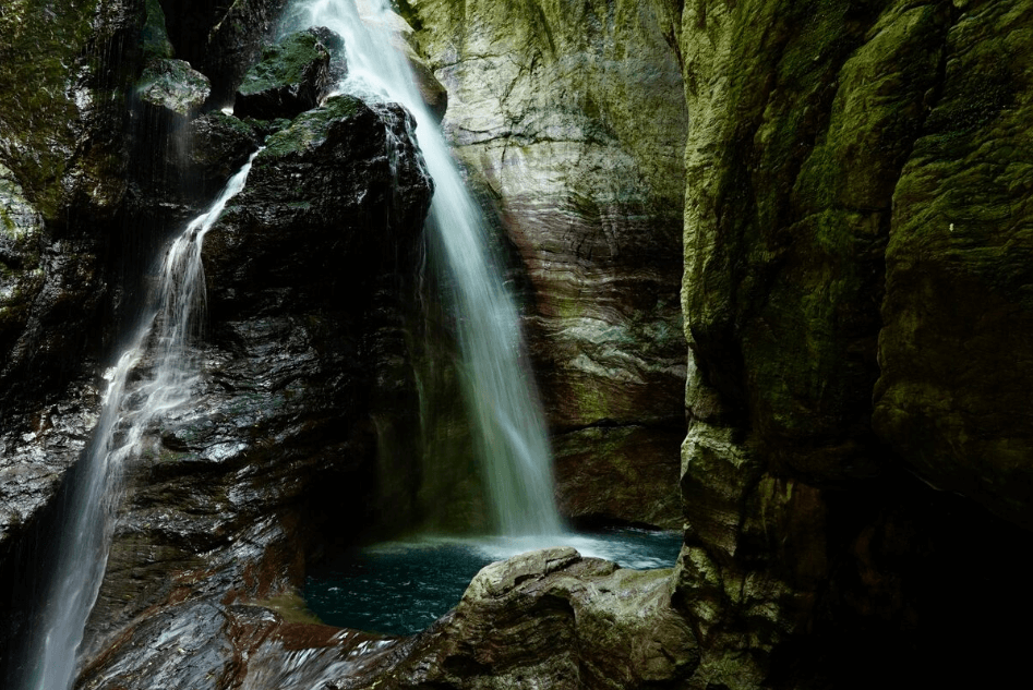 Waterfalls pooling inside a rocky cave, photographed using the Sony 24 to 70mm f4 Zeiss lens