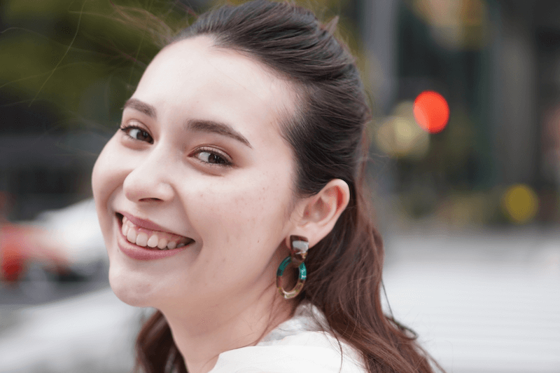 Head shot of a smiling woman, taken with the Sony ZV-E10