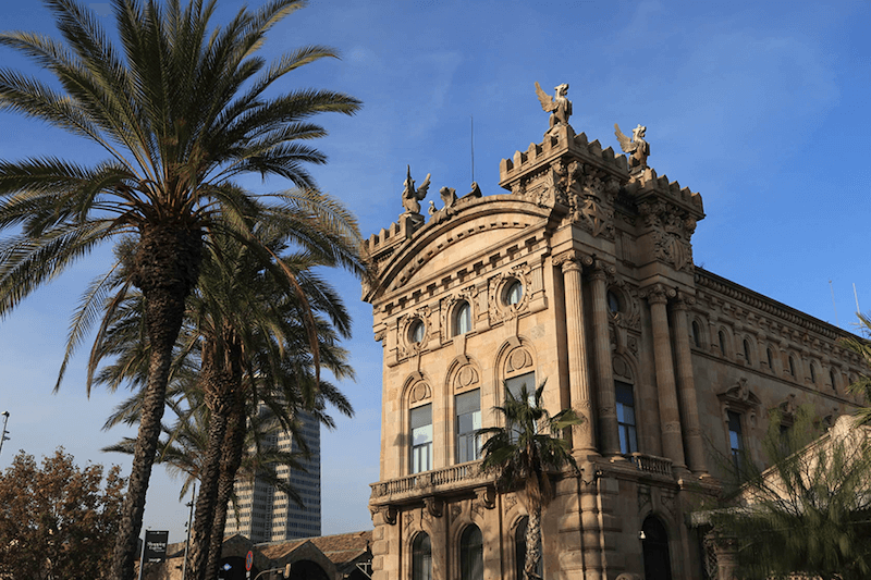 Old building with a palm tree in front, taken with Canon G7X Mark II