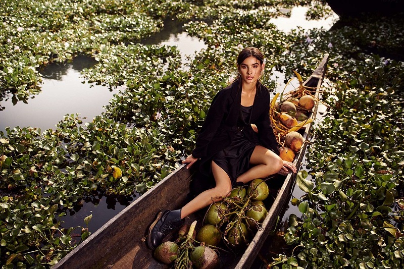 profoto b10 plus used as lighting for a model sitting on a boat