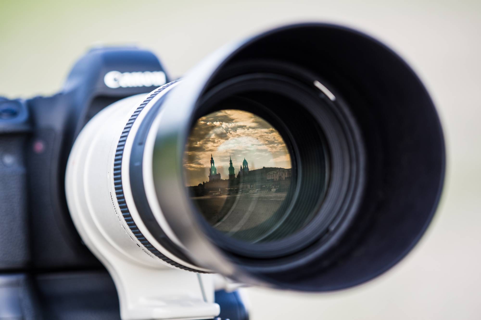 image of a historical building reflected on the lens of a camera