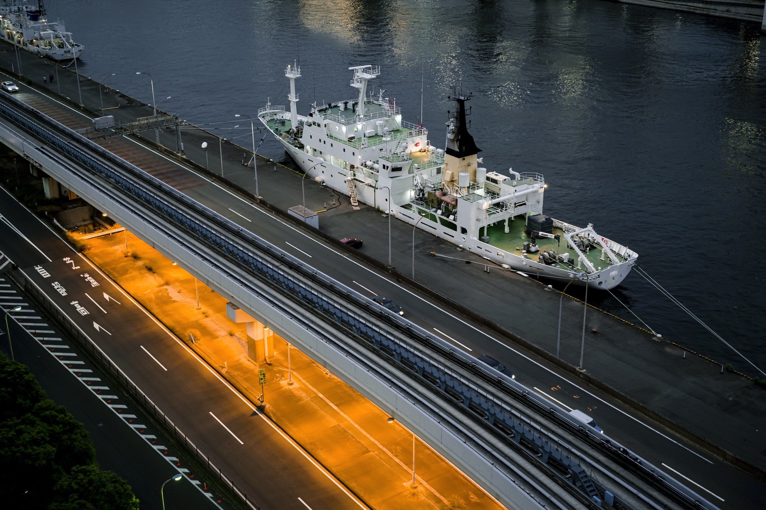 White ship docked beside elevated road, photographed with the Sigma fp camera