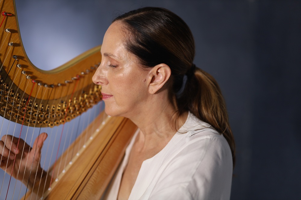 woman playing a harp