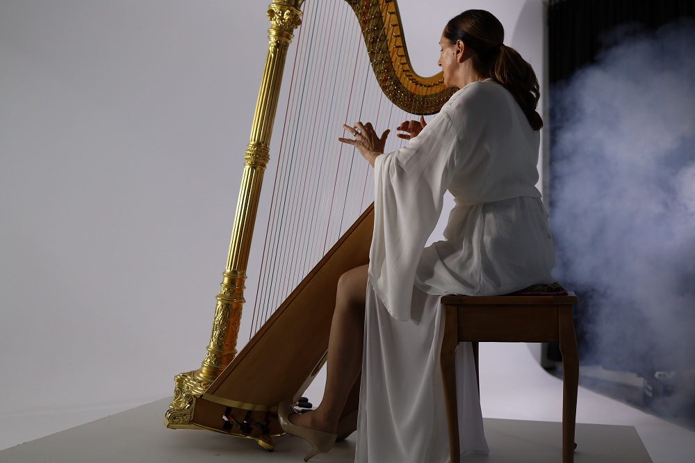 woman playing a harp