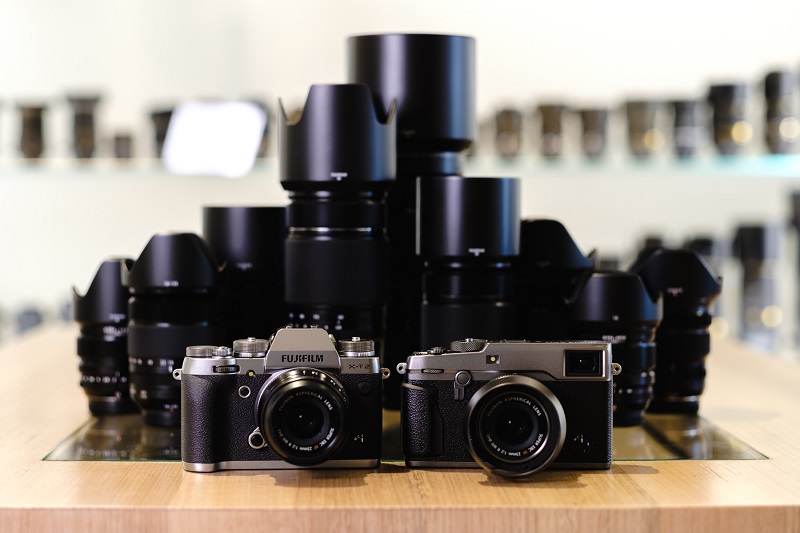 a couple of camera and a range of lenses