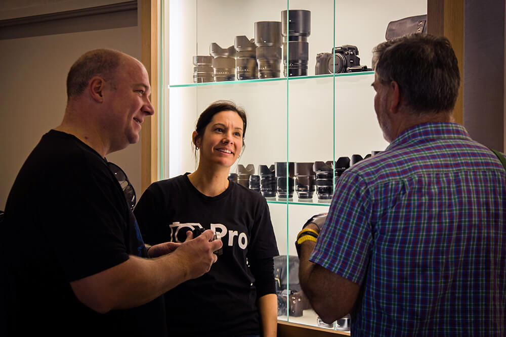 Two CameraPro employees talking to a customer