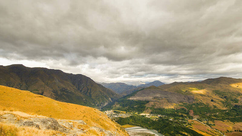 Overcast sky above a golden-yellow mountain – photographed with the Nikon D7500 DSLR camera