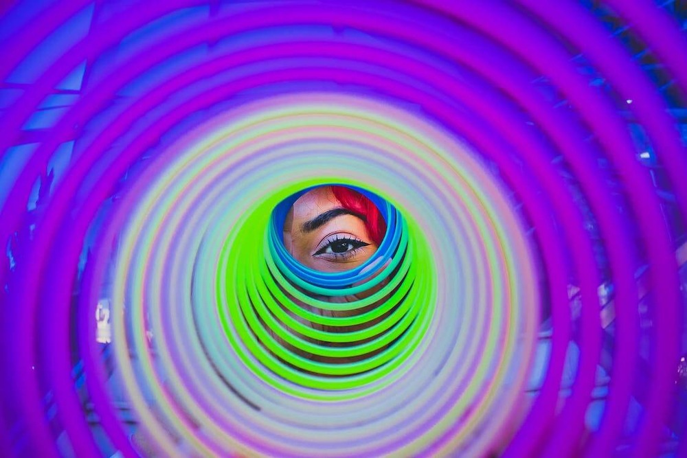 person-looking-through-a-slinky-toy