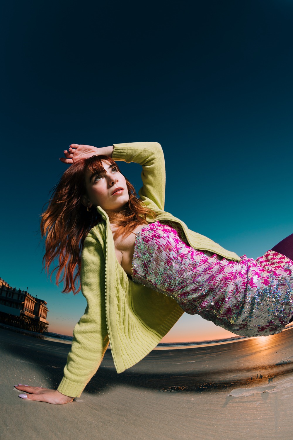 pretty-redhead-posing-on-a-beach-at-sunset