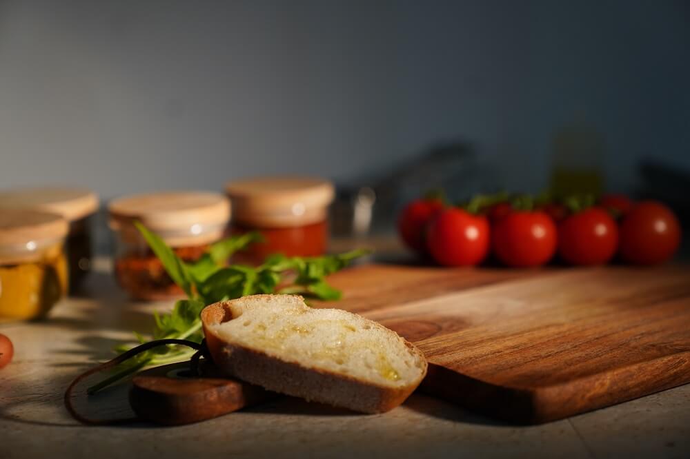 Product photography of a bread with various cooking ingredients