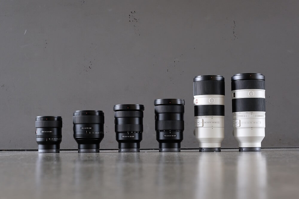 Shot of various camera lenses on gray background