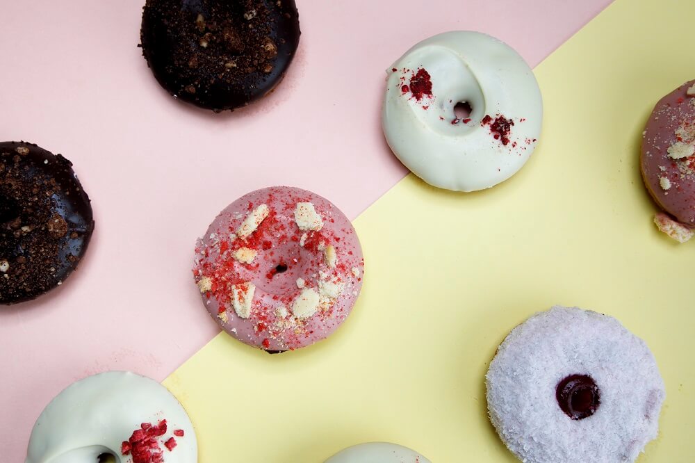 Creative product photography flat lay of doughnuts