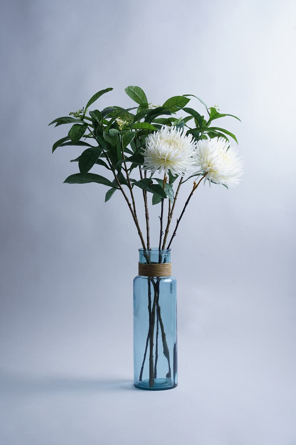 Product photography shot of a vase with flowers