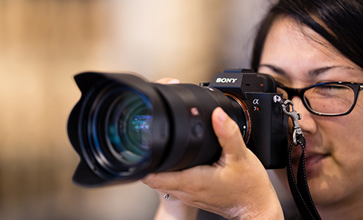 female photographer using a sony camera