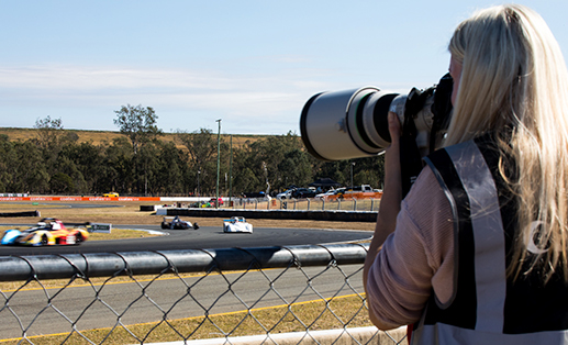 photographer covering a car race