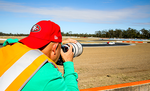 photographer covering a car race