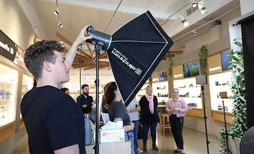 man fixing elinchrom studio light