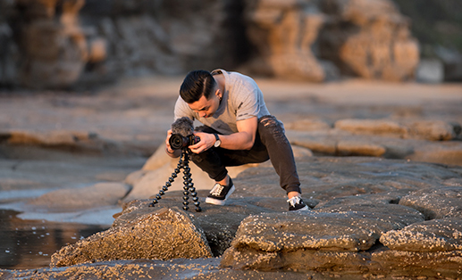 photographer taking a photo of the sunset