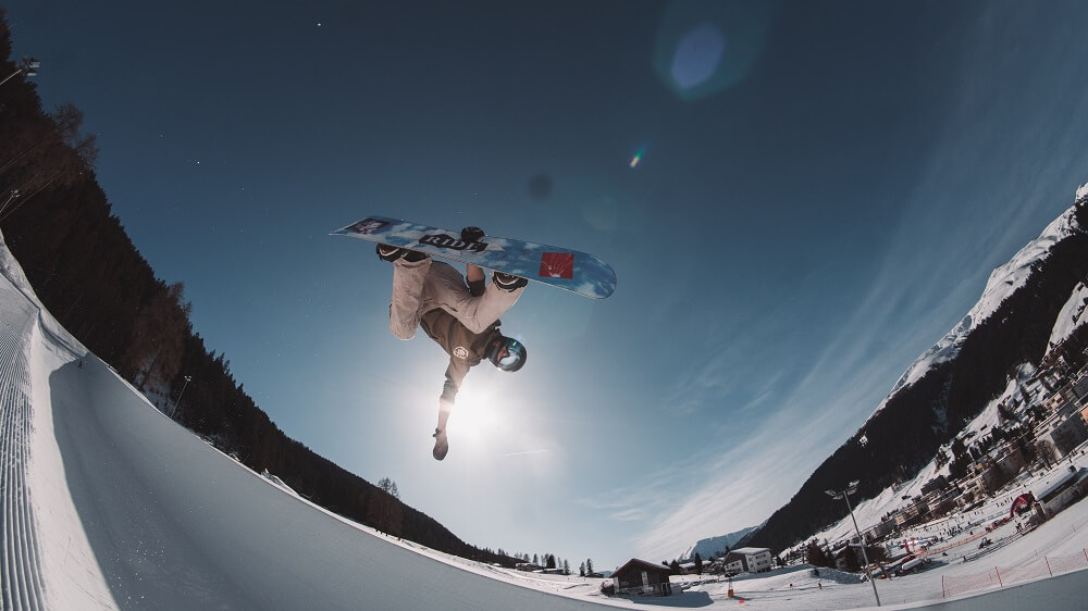 a sports photography shot of an athlete on a snow board