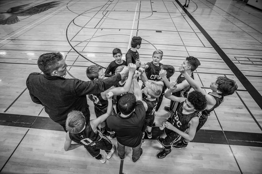 A sports photography shot of a team of young basketball players