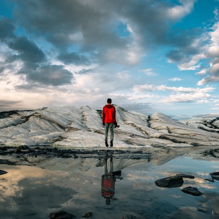 travel photography man in red windbreaker