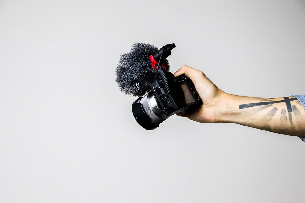 Hand of a man with a video camera