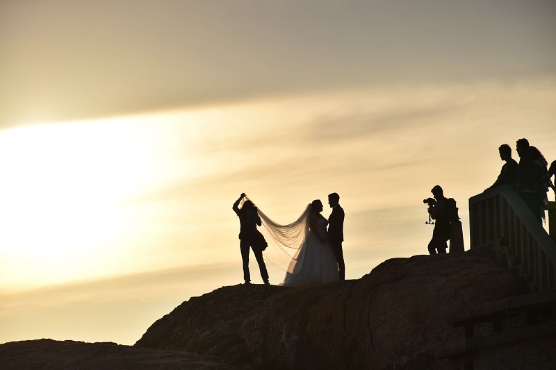 a silhouette of the bride, groom during a wedding photoshoot